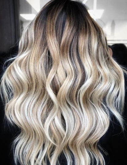 icy blonde balayage with dark roots