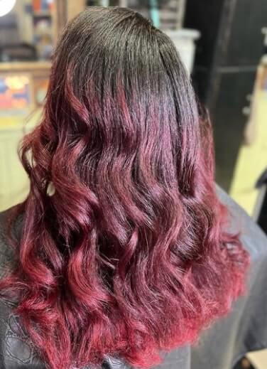 dark brown hair with red ombre highlights