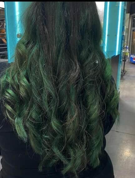 black hair with emerald green highlights